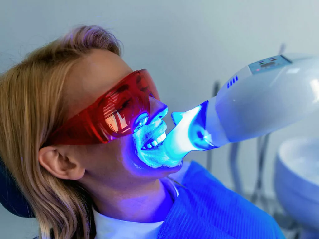dental patient receiving whitening service