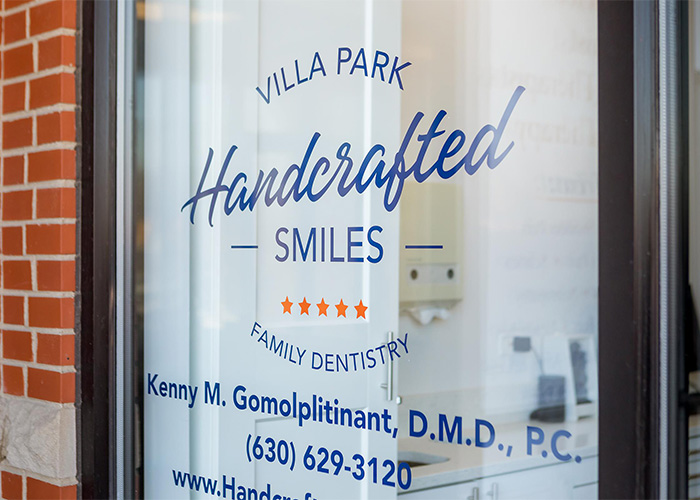 Front window showing the logo at handcrafted smiles villa park