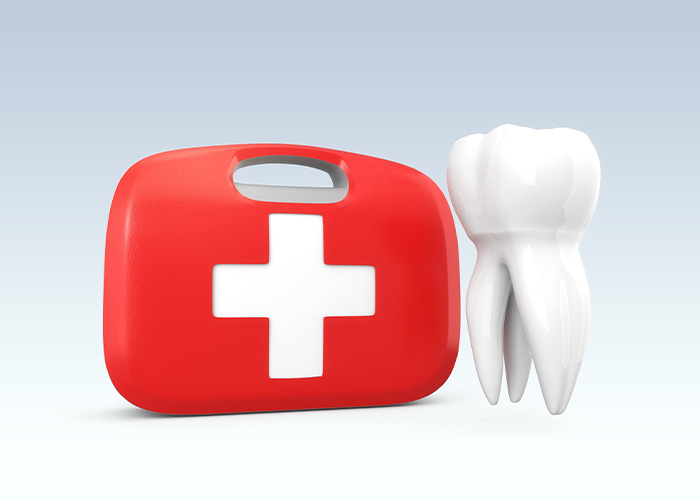 illustration of a tooth next to a red first aid kit